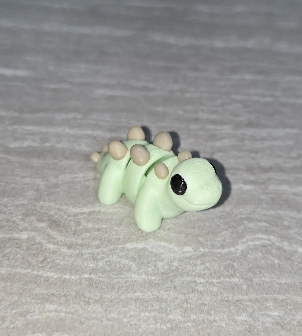 Stegosaurus 3D printed articulated flexi toy by Cosmic 3D Creations