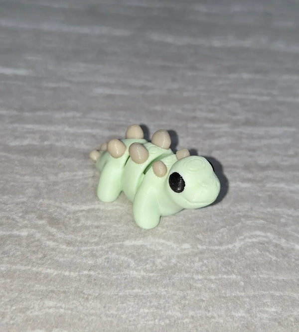 Stegosaurus 3D printed articulated flexi toy by Cosmic 3D Creations