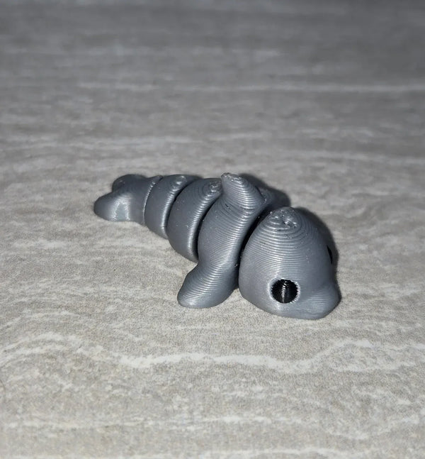 Dolphin 3D printed articulated flexi toy by Cosmic 3D Creations