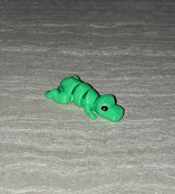 T-Rex 3D printed articulated flexi toy by Cosmic 3D Creations