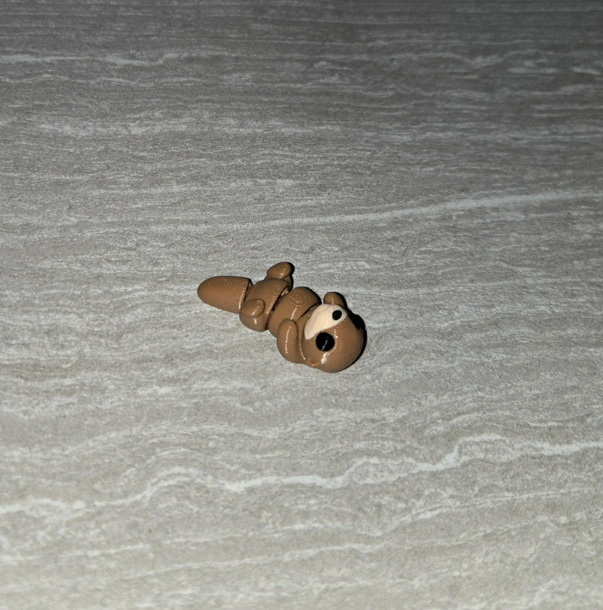 Otter 3D printed articulated flexi toy by Cosmic 3D Creations