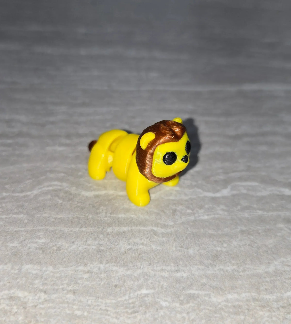Lion 3D printed articulated flexi toy by Cosmic 3D Creations