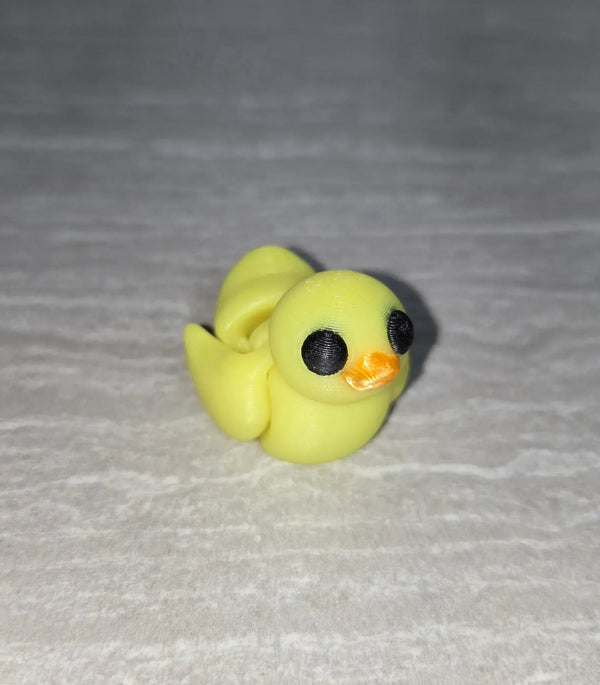 Duck 3D printed articulated flexi toy by Cosmic 3D Creations