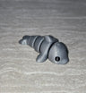 Dolphin 3D printed articulated flexi toy by Cosmic 3D Creations
