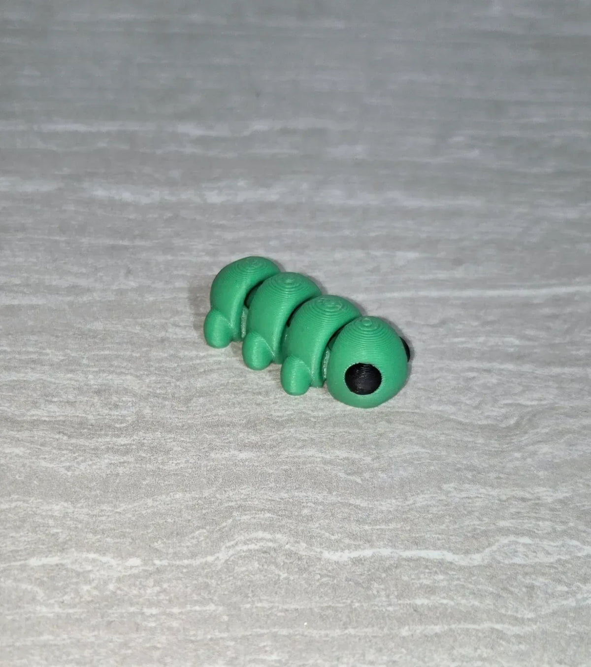 Round Caterpillar 3D printed articulated flexi toy by Cosmic 3D Creations