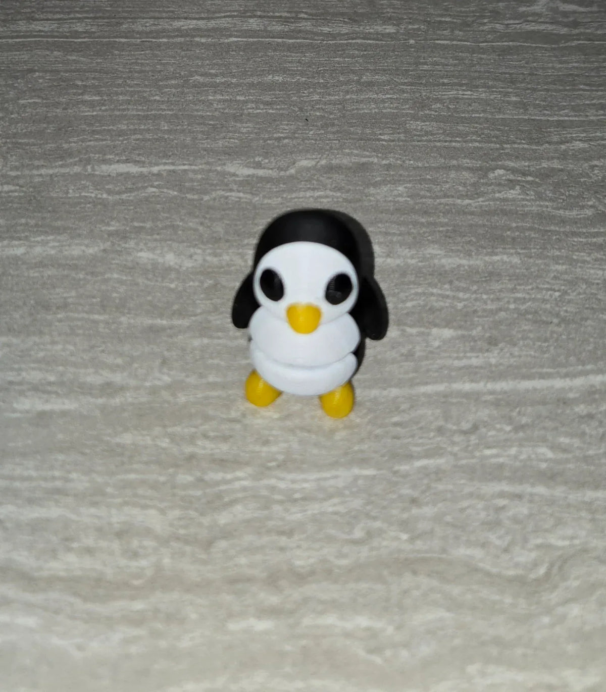 Penguin 3D printed articulated flexi toy by Cosmic 3D Creations