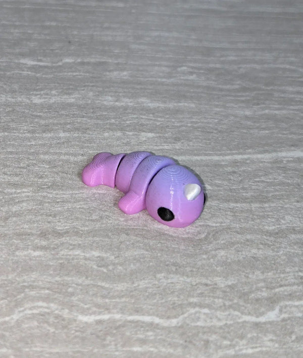 Narwhal 3D printed articulated flexi toy by Cosmic 3D Creations