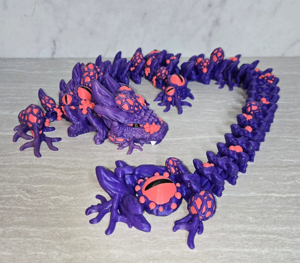 Infected Dragon 3D printed articulated flexi toy by Cosmic 3D Creations