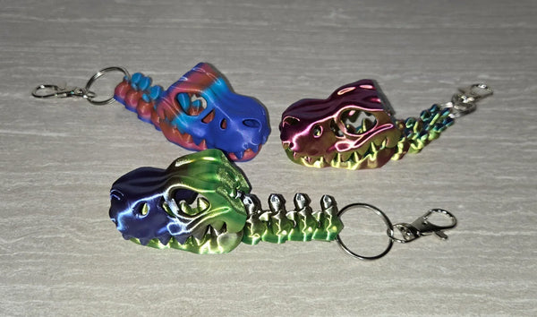 Bone T-Rex Keychain 3D printed articulated flexi keychain by Cosmic 3D Creations