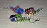 Bone T-Rex Keychain 3D printed articulated flexi keychain by Cosmic 3D Creations