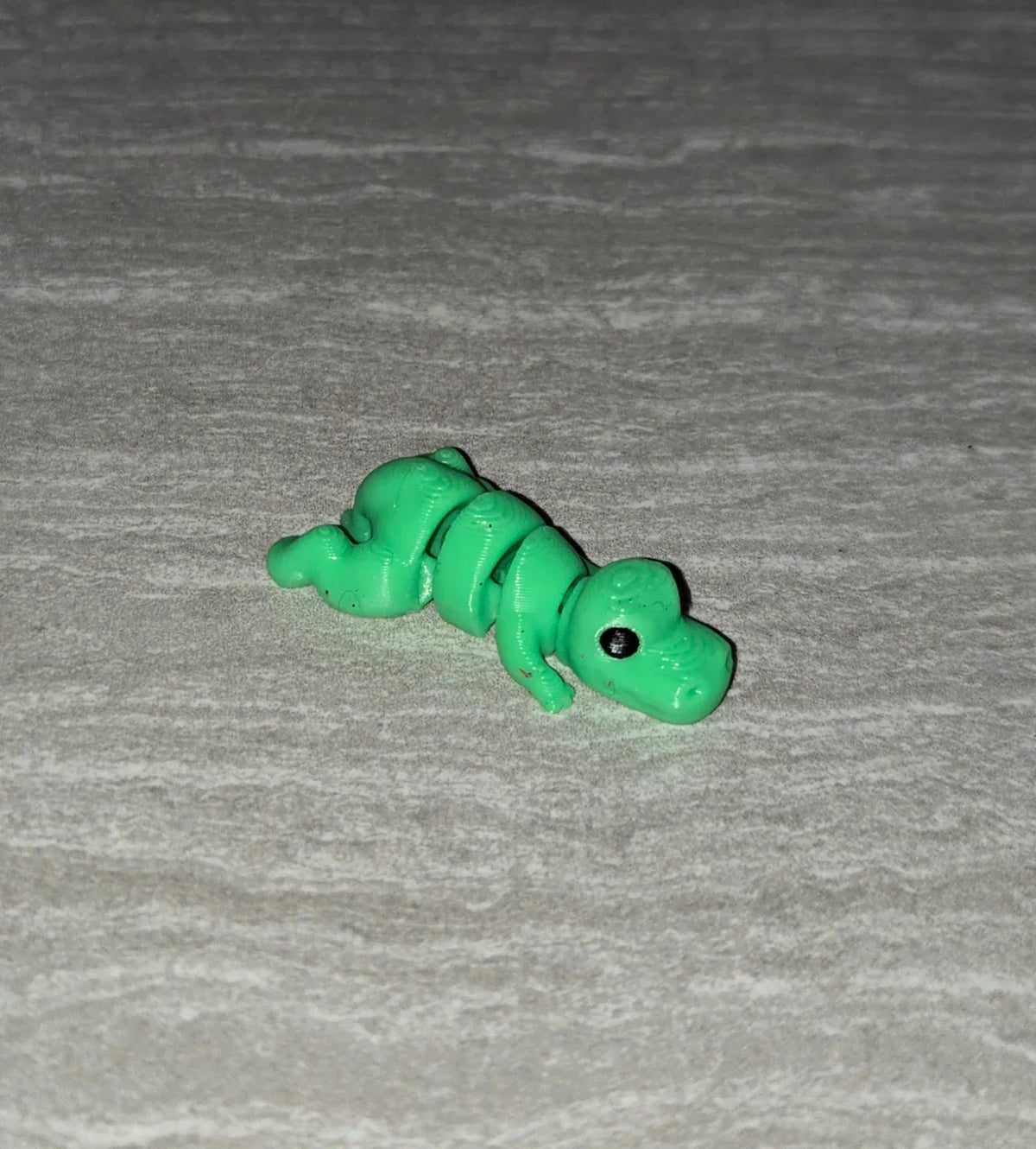 T-Rex 3D printed articulated flexi toy by Cosmic 3D Creations