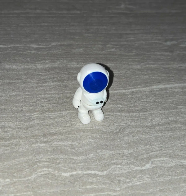 Astronaut 3D printed articulated flexi toy by Cosmic 3D Creations