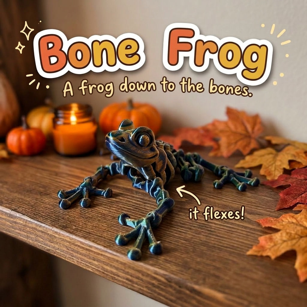 Bone Frog 3D printed articulated flexi toy by Cosmic 3D Creations, on a cozy autumn shelf with pumpkins