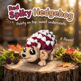 Red Spiky Hedgehog 3D printed articulated flexi toy by Cosmic 3D Creations, on a tree stump with moss and pine cones