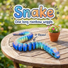 Snake 3D printed articulated flexi toy by Cosmic 3D Creations, on a sunny garden table with flowers