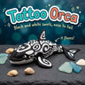 Tattoo Orca 3D printed articulated flexi toy by Cosmic 3D Creations, on slate with shells and sea glass