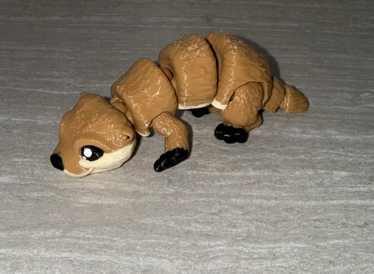 Otter 3D printed articulated flexi toy by Cosmic 3D Creations