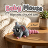 Baby Mouse 3D printed articulated flexi toy by Cosmic 3D Creations, on a cozy side table with a knit blanket
