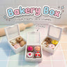 Bakery Box 3D printed clicker fidget toy with donuts, cupcakes and pastries, on a bakery counter