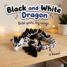 Black and White Dragon 3D printed articulated flexi toy by Cosmic 3D Creations, on a cozy shelf with fairy lights