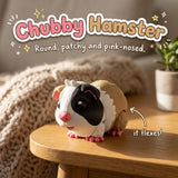 Chubby Hamster 3D printed articulated flexi toy by Cosmic 3D Creations, on a cozy side table with a knit blanket