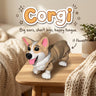 Corgi 3D printed articulated flexi toy by Cosmic 3D Creations, on a cozy side table with a knit blanket