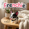 Frenchie 3D printed articulated flexi toy by Cosmic 3D Creations, on a cozy side table with a knit blanket
