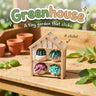 Greenhouse 3D printed clicker fidget toy with four tiny potted plants, on a sunny potting bench