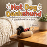 Hot Dog Dachshund 3D printed articulated flexi toy by Cosmic 3D Creations, on a cozy side table with a knit blanket