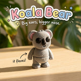 Koala Bear 3D printed articulated flexi toy by Cosmic 3D Creations, on a sunlit table with tropical leaves