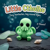 Little Cthulhu 3D printed articulated flexi toy by Cosmic 3D Creations, on slate with shells and sea glass