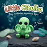 Little Cthulhu 3D printed articulated flexi toy by Cosmic 3D Creations, on slate with shells and sea glass