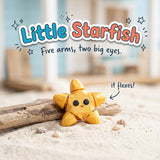 Little Starfish 3D printed articulated flexi toy by Cosmic 3D Creations, on sand with driftwood and shells