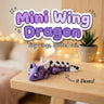 Mini Wing Dragon 3D printed articulated flexi toy by Cosmic 3D Creations, on a cozy shelf with fairy lights