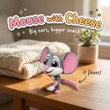 Mouse with Cheese 3D printed articulated flexi toy by Cosmic 3D Creations, on a cozy side table with a knit blanket