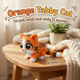 Orange Tabby Cat 3D printed articulated flexi toy by Cosmic 3D Creations, on a cozy side table with a knit blanket