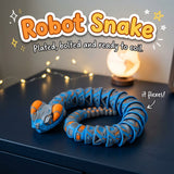 Robot Snake 3D printed articulated flexi toy by Cosmic 3D Creations, on a desk with star lights