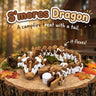 S'mores Dragon 3D printed articulated flexi toy by Cosmic 3D Creations, on a tree stump with moss and pine cones