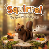 Squirrel 3D printed articulated flexi toy by Cosmic 3D Creations, on a tree stump with moss and pine cones