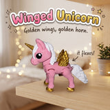 Winged Unicorn 3D printed articulated flexi toy by Cosmic 3D Creations, on a cozy shelf with fairy lights